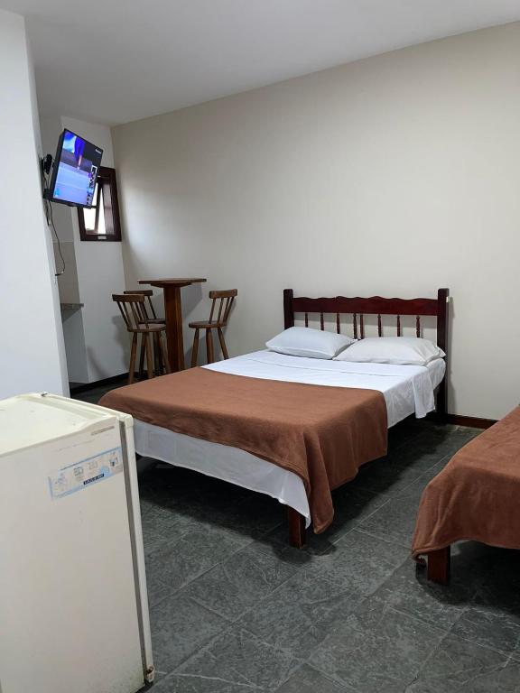 Cama ou camas em um quarto em Pousada Terra Do Sol