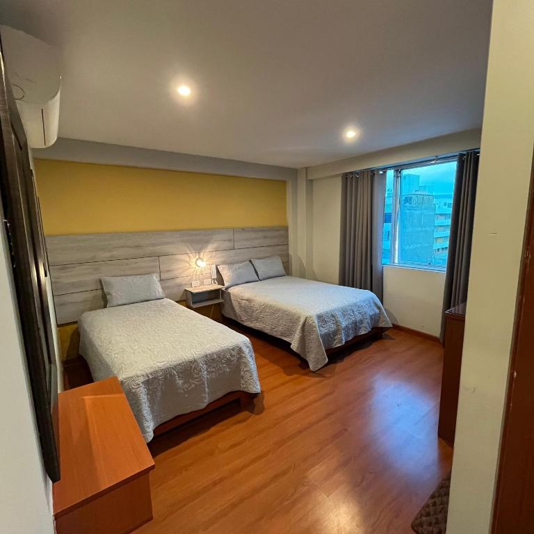 Postel nebo postele na pokoji v ubytování HOTEL SUDAMERICANA INN