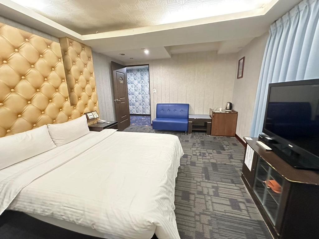 TV a/nebo společenská místnost v ubytování Wecity Hotel 薇城精緻旅店