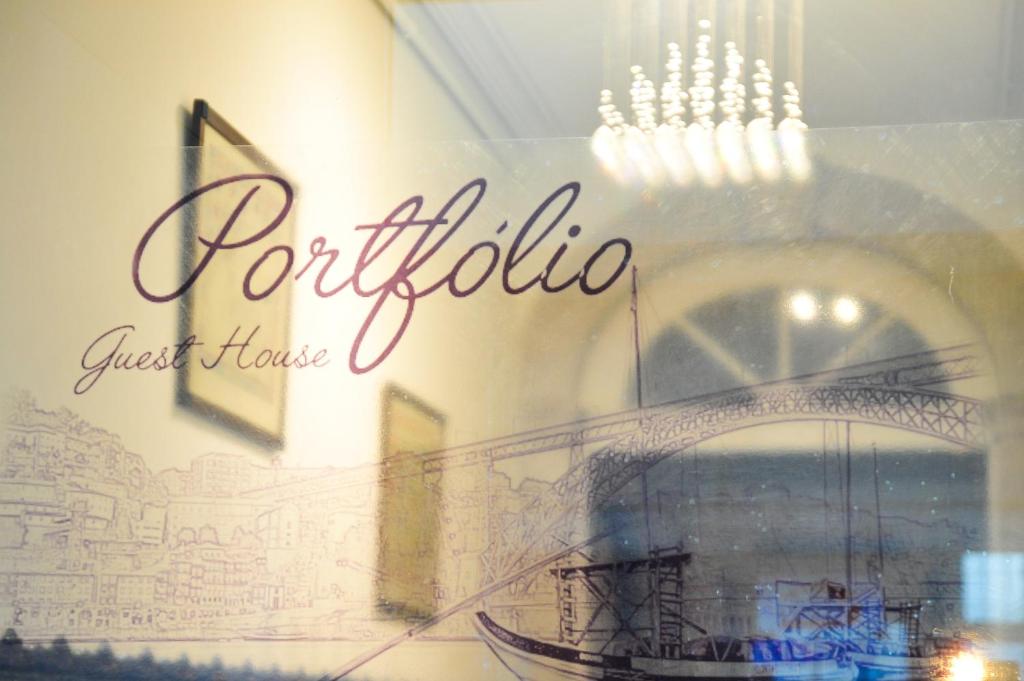 a painting of a building on a wall at Portfolio Guest House in Porto