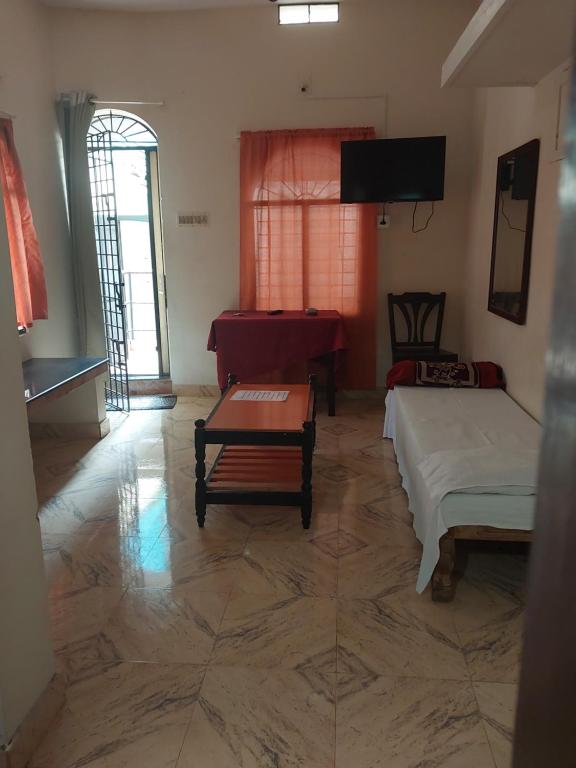 Postel nebo postele na pokoji v ubytování Taj Mahal Hotel