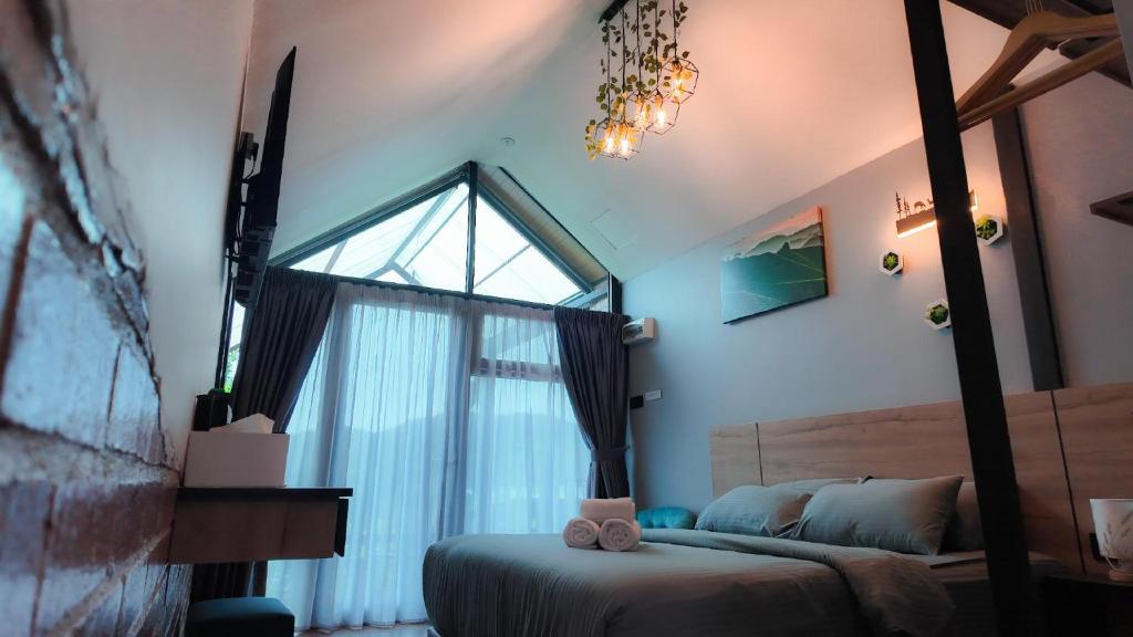 Postel nebo postele na pokoji v ubytování Campod Resort @ Cameron Highlands