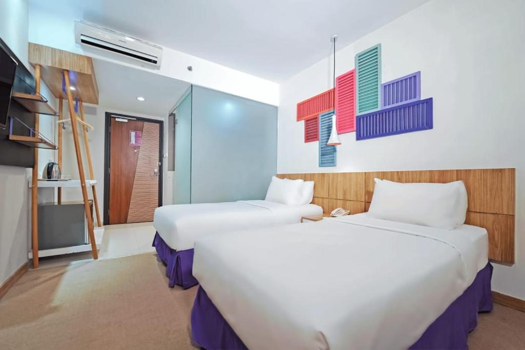 Voodi või voodid majutusasutuse Tjokro Style Yogyakarta toas