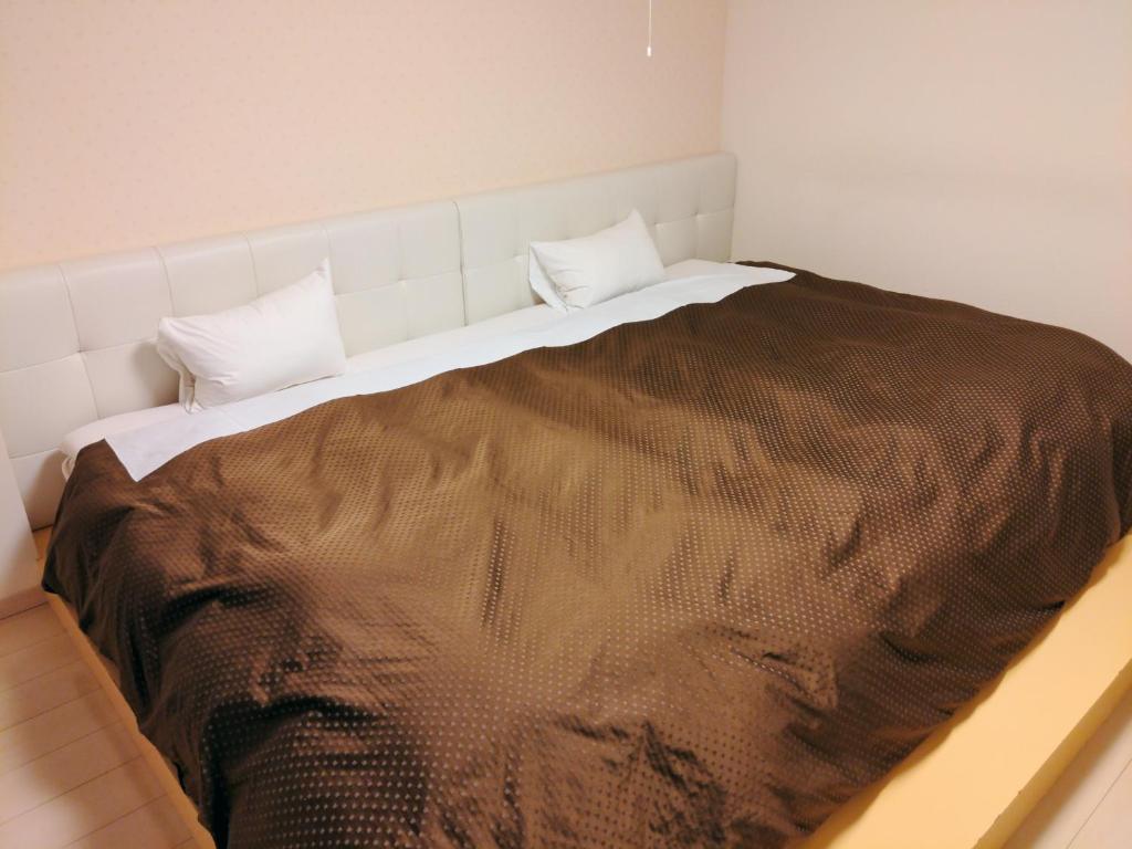 Postel nebo postele na pokoji v ubytování Wellness Forest Ito - Kyoritsu Resort