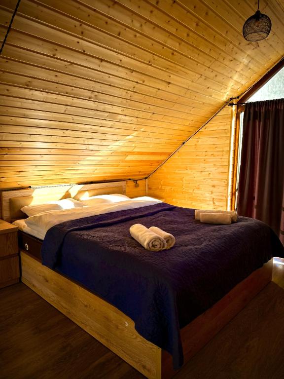 Postel nebo postele na pokoji v ubytování Cottages DILA