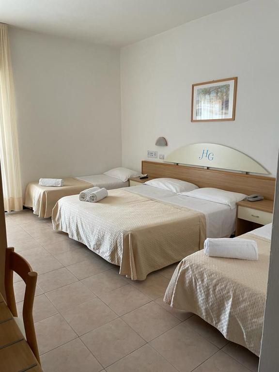 Postel nebo postele na pokoji v ubytování Hotel Gabbiano