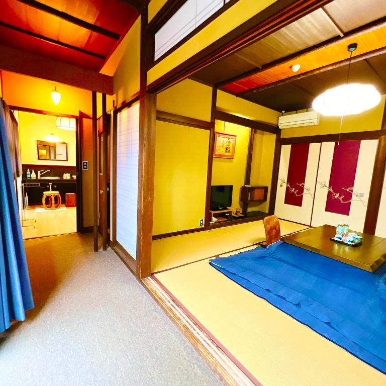 Postel nebo postele na pokoji v ubytování Japanese style hotel and dining Morigen