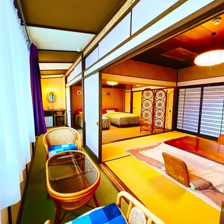 Postel nebo postele na pokoji v ubytování Japanese style hotel and dining Morigen