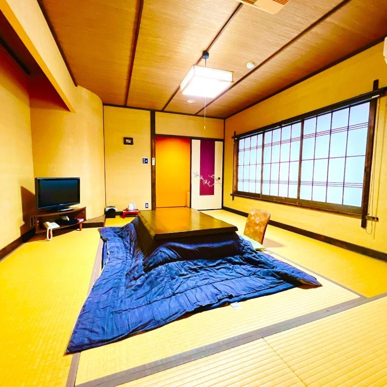Postel nebo postele na pokoji v ubytování Japanese style hotel and dining Morigen