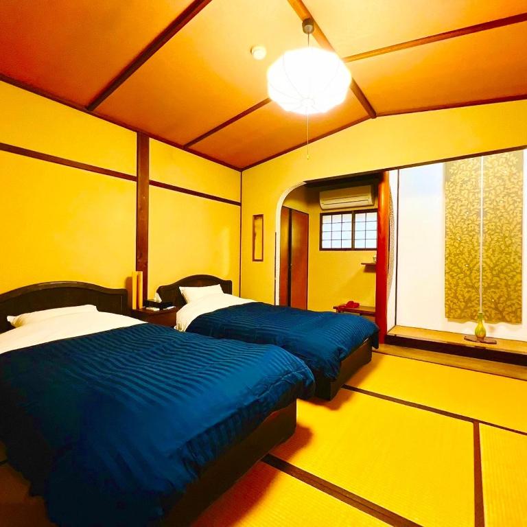 Postel nebo postele na pokoji v ubytování Japanese style hotel and dining Morigen