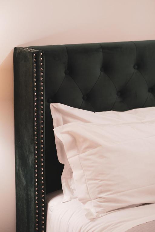 Postel nebo postele na pokoji v ubytování Carlo Felice Boutique Hotel