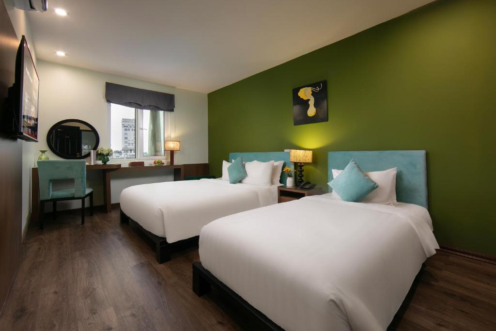 Postel nebo postele na pokoji v ubytování Anise Hotel & Spa Hanoi