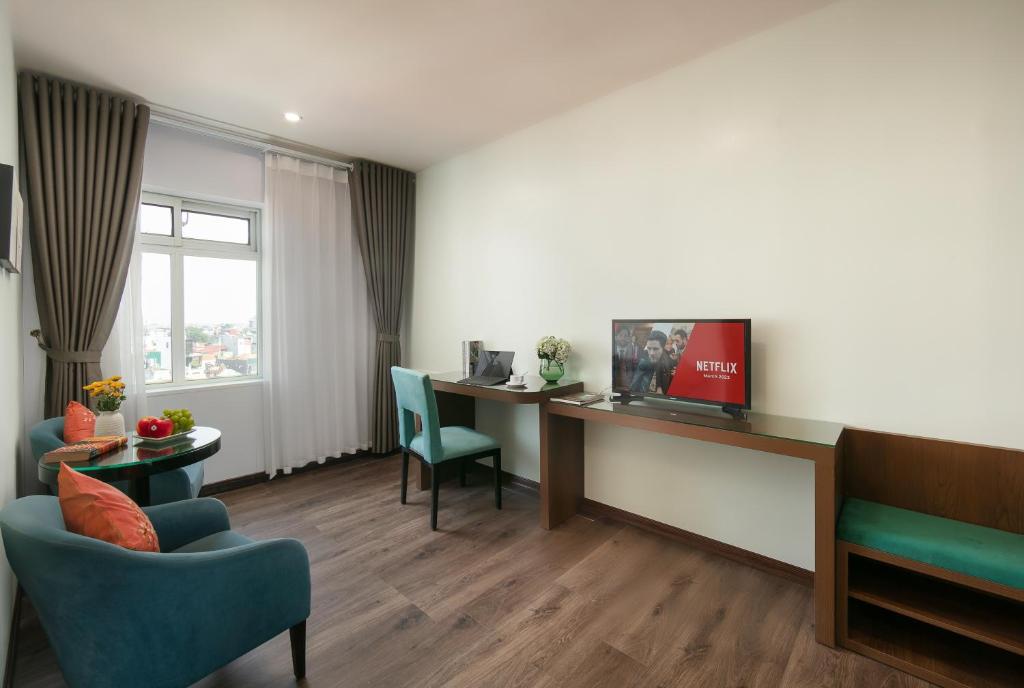 TV a/nebo společenská místnost v ubytování Anise Hotel & Spa Hanoi