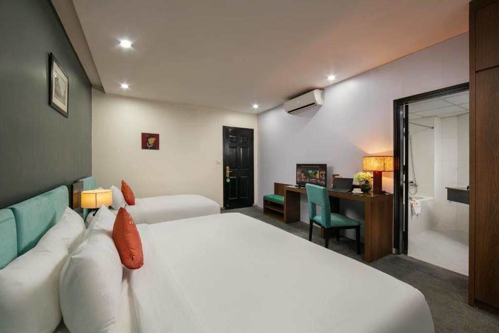 Postel nebo postele na pokoji v ubytování Anise Hotel & Spa Hanoi