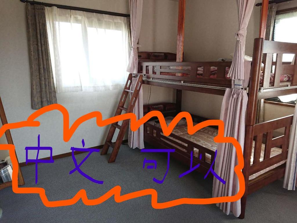 Postel nebo postele na pokoji v ubytování Guesthouse Gifu SUAI