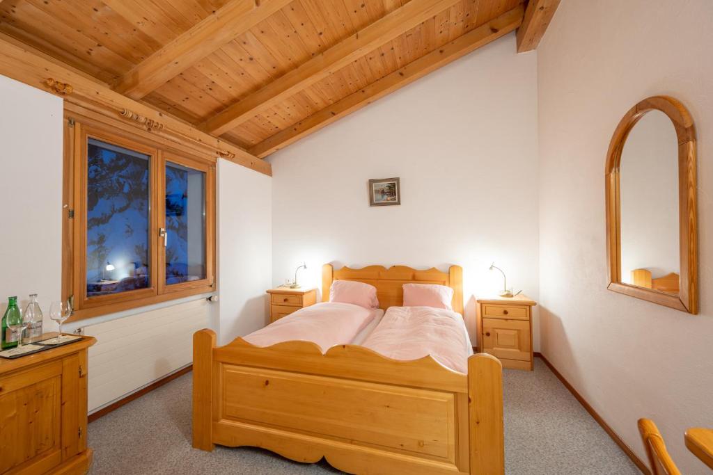 Postel nebo postele na pokoji v ubytování Hotel Cristallina