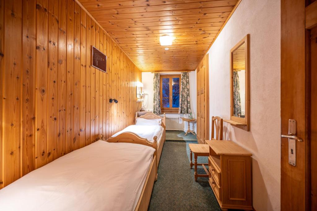 Postel nebo postele na pokoji v ubytování Hotel Cristallina