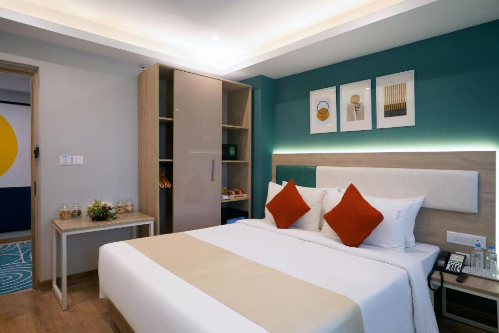 Postel nebo postele na pokoji v ubytování Sarovar Portico Kolkata
