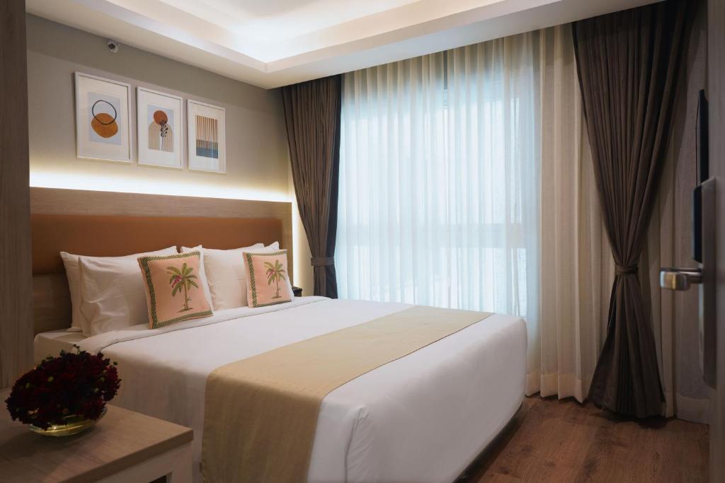 Postel nebo postele na pokoji v ubytování Sarovar Portico Kolkata