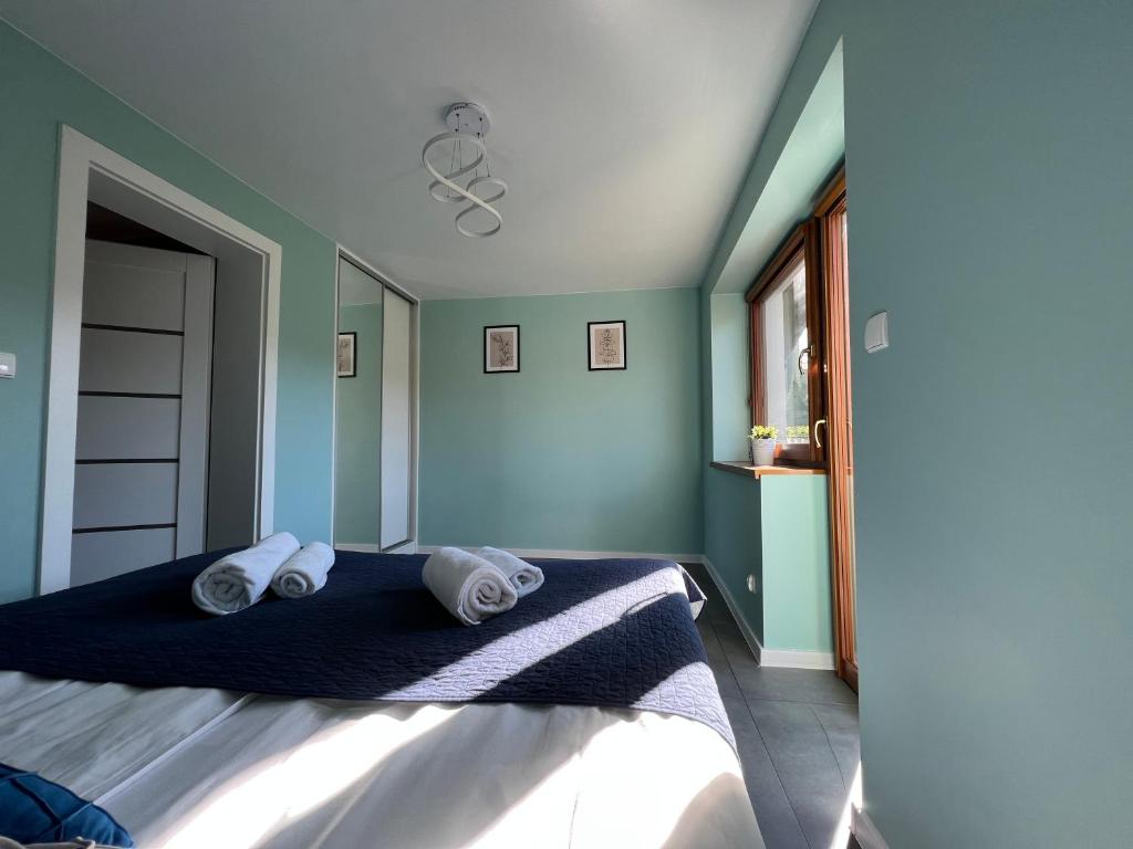Postel nebo postele na pokoji v ubytování Apartamenty River
