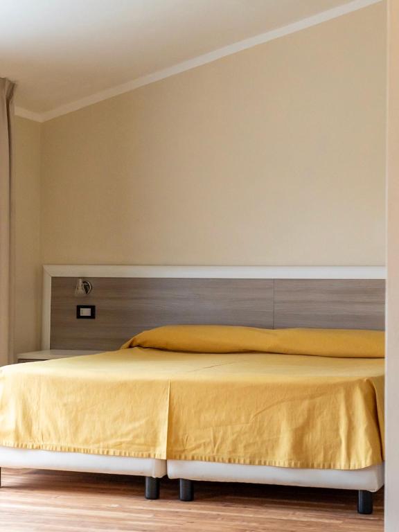 Postel nebo postele na pokoji v ubytování Hotel Fabricia