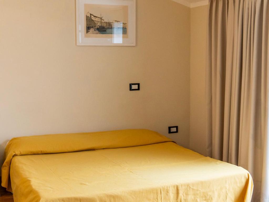 Postel nebo postele na pokoji v ubytování Hotel Fabricia