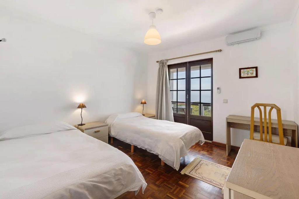 Cama o camas de una habitación en Alto da Praia Villa