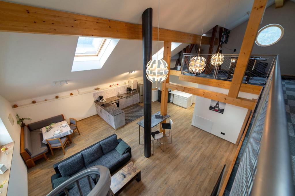 an overhead view of the living room and kitchen of a house at Turmhus in Bürs
