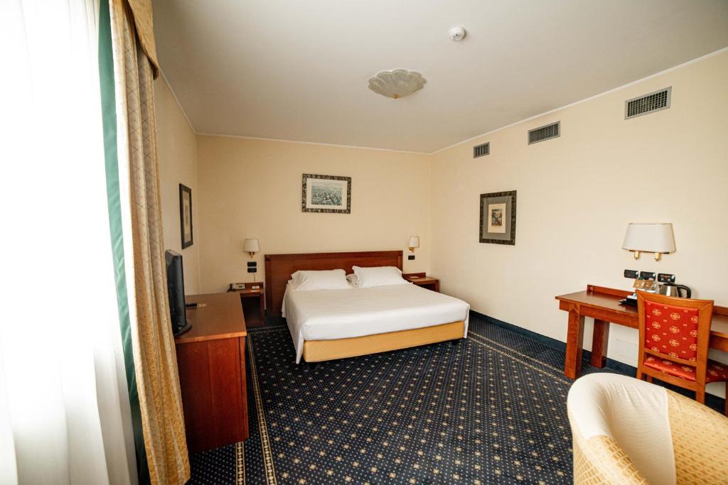 Postel nebo postele na pokoji v ubytování Phi Hotel Cavalieri
