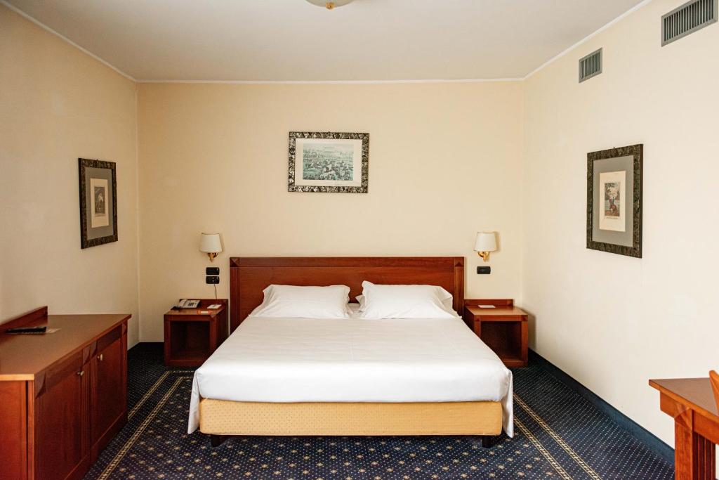 Postel nebo postele na pokoji v ubytování Phi Hotel Cavalieri