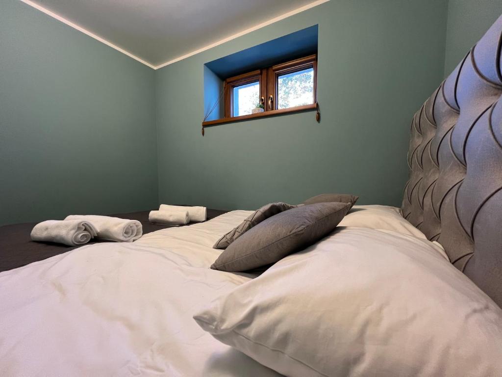 Postel nebo postele na pokoji v ubytování Apartamenty River
