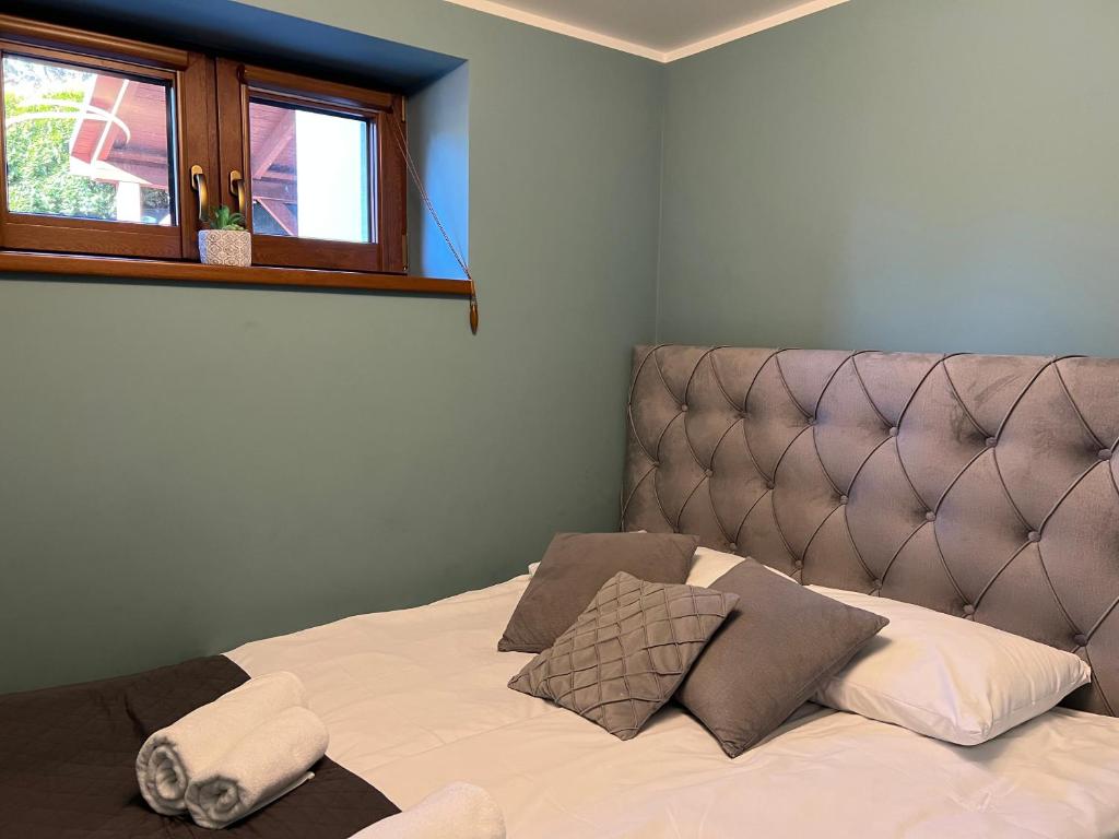 Postel nebo postele na pokoji v ubytování Apartamenty River