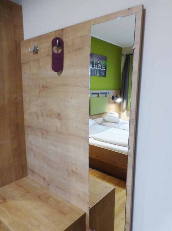 Postel nebo postele na pokoji v ubytování Da`Sporrer Hotel & Wirtshaus