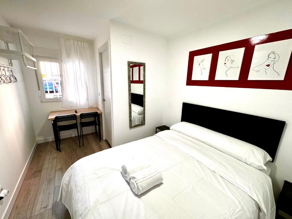 Katil atau katil-katil dalam bilik di Rooms Rayo