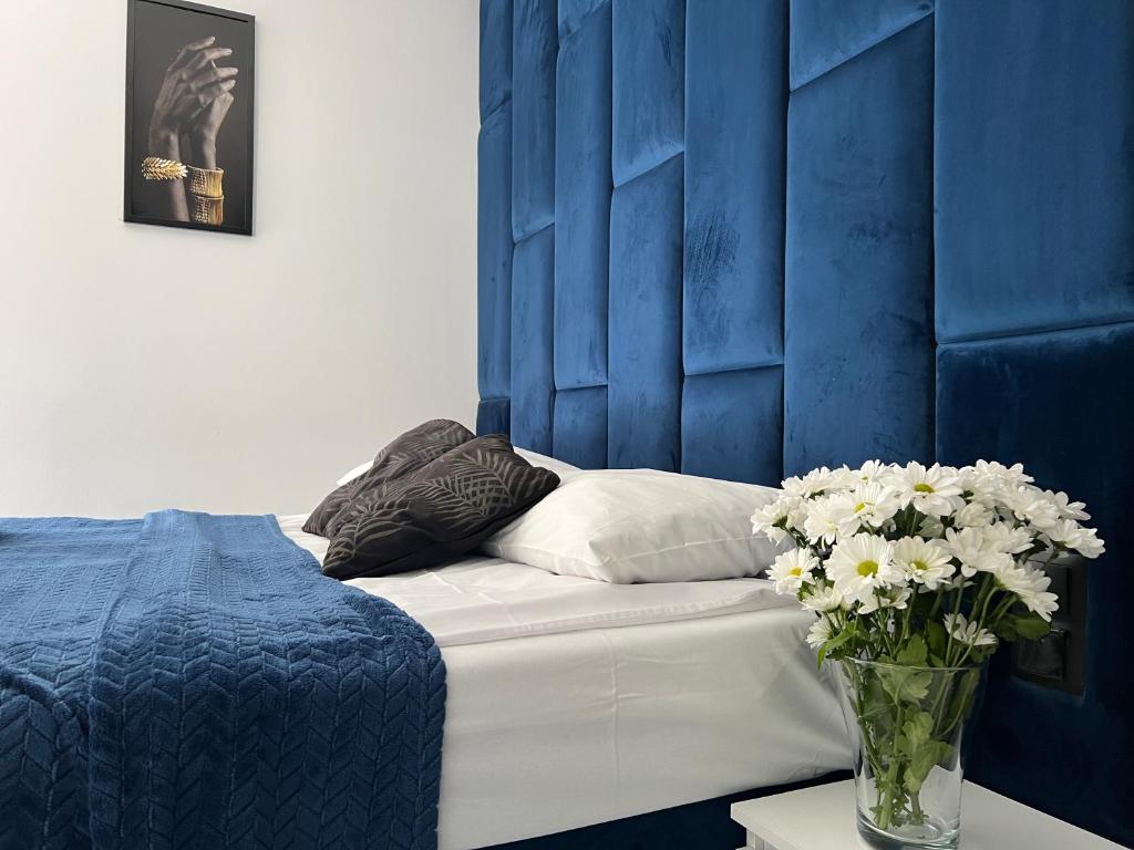 Postel nebo postele na pokoji v ubytování Apartamenty River