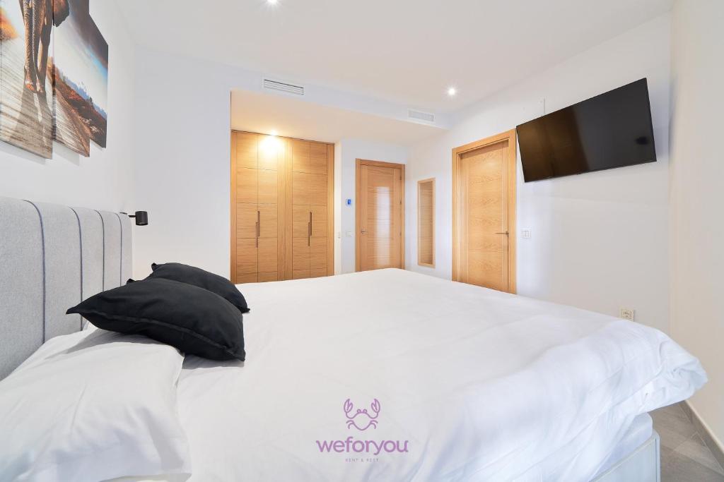 Posteľ alebo postele v izbe v ubytovaní weforyou Isla de Poniente 2 Bedrooms and Parking