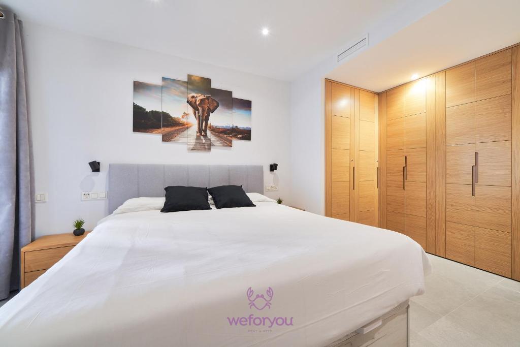 Posteľ alebo postele v izbe v ubytovaní weforyou Isla de Poniente 2 Bedrooms and Parking