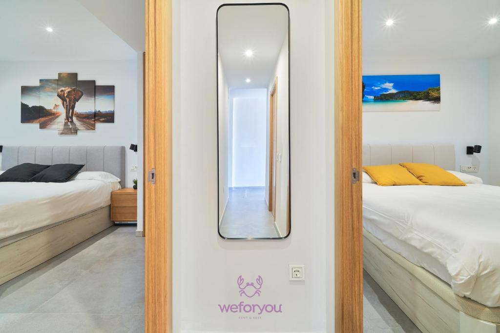 Posteľ alebo postele v izbe v ubytovaní weforyou Isla de Poniente 2 Bedrooms and Parking