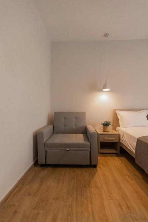 Postel nebo postele na pokoji v ubytování Porto Dionysos