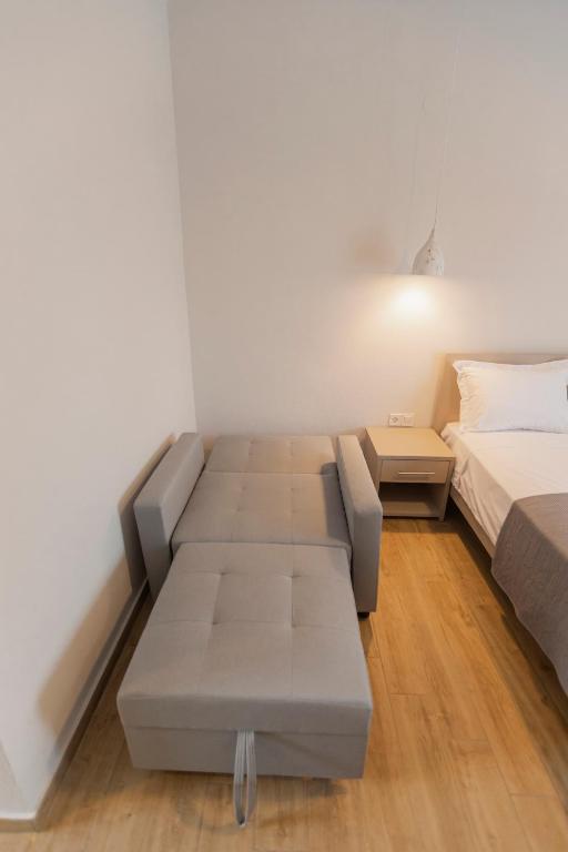 Postel nebo postele na pokoji v ubytování Porto Dionysos