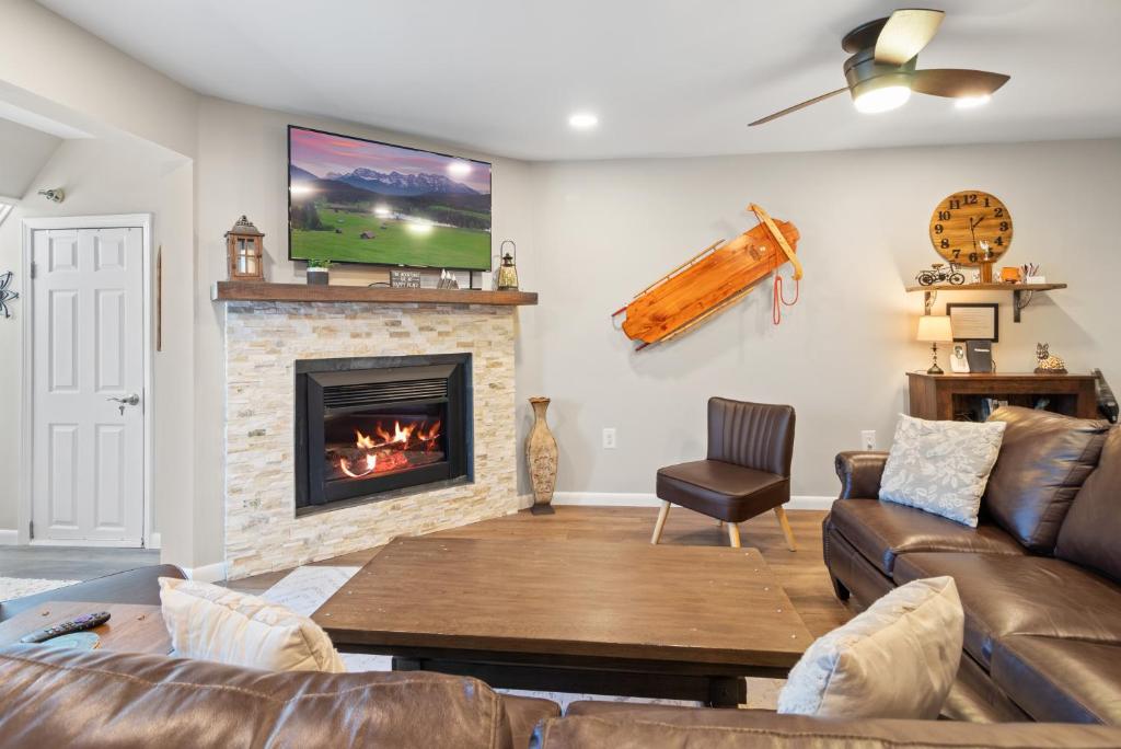 a living room with a couch and a fireplace at LB207A Newly Renovated Family Friendly Washer Dryer Fireplace WiFi EZ Parking in Snowshoe