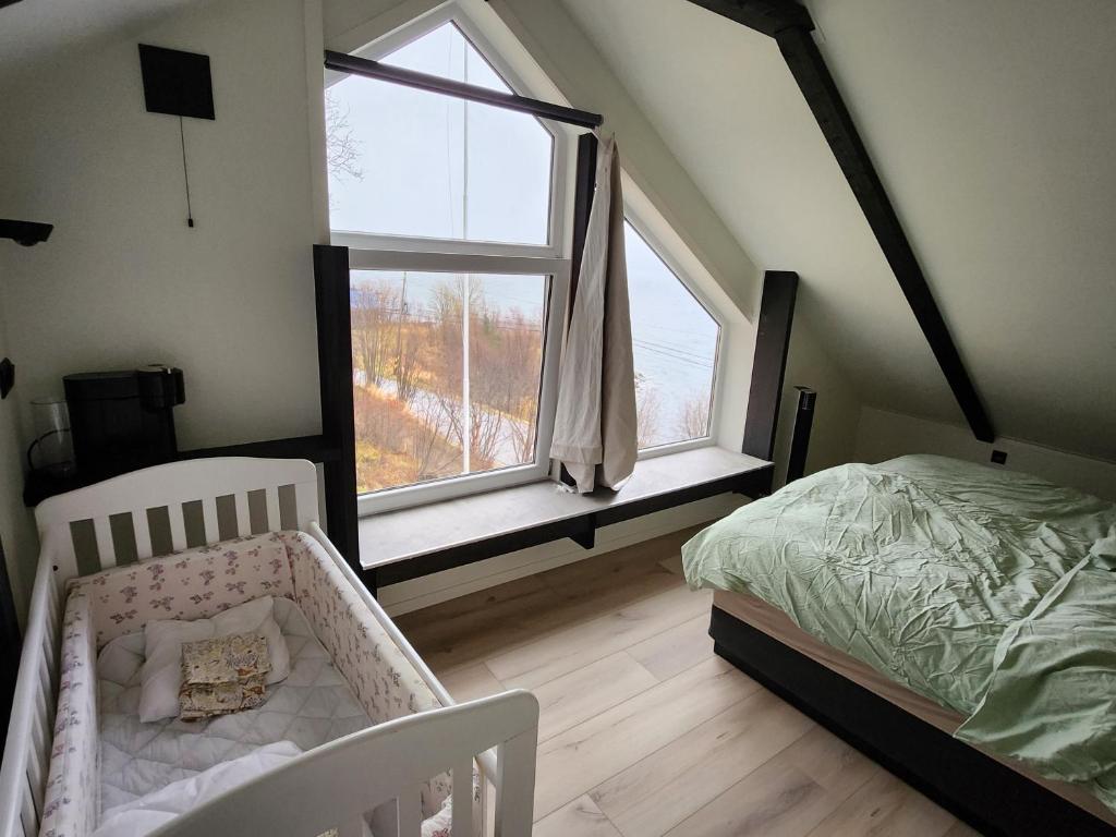 Ένα ή περισσότερα κρεβάτια σε δωμάτιο στο Senja Skaland