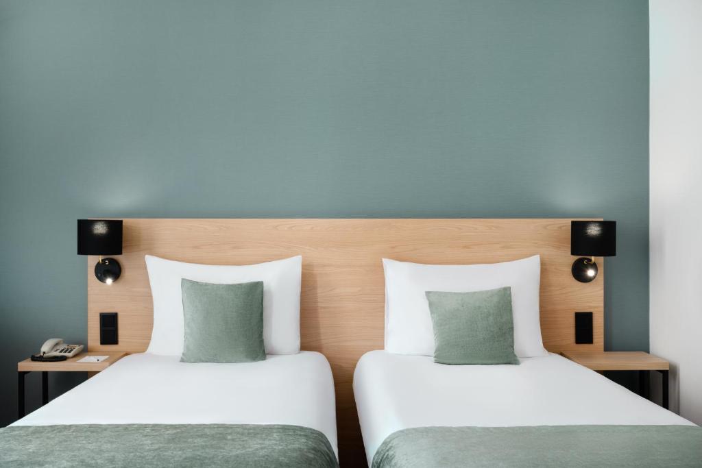 Postel nebo postele na pokoji v ubytování Hotel Bristol Budapest