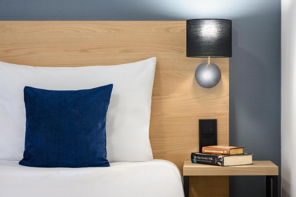 Postel nebo postele na pokoji v ubytování Hotel Bristol Budapest