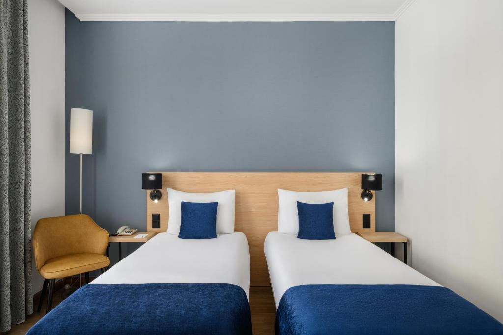 Postel nebo postele na pokoji v ubytování Hotel Bristol Budapest
