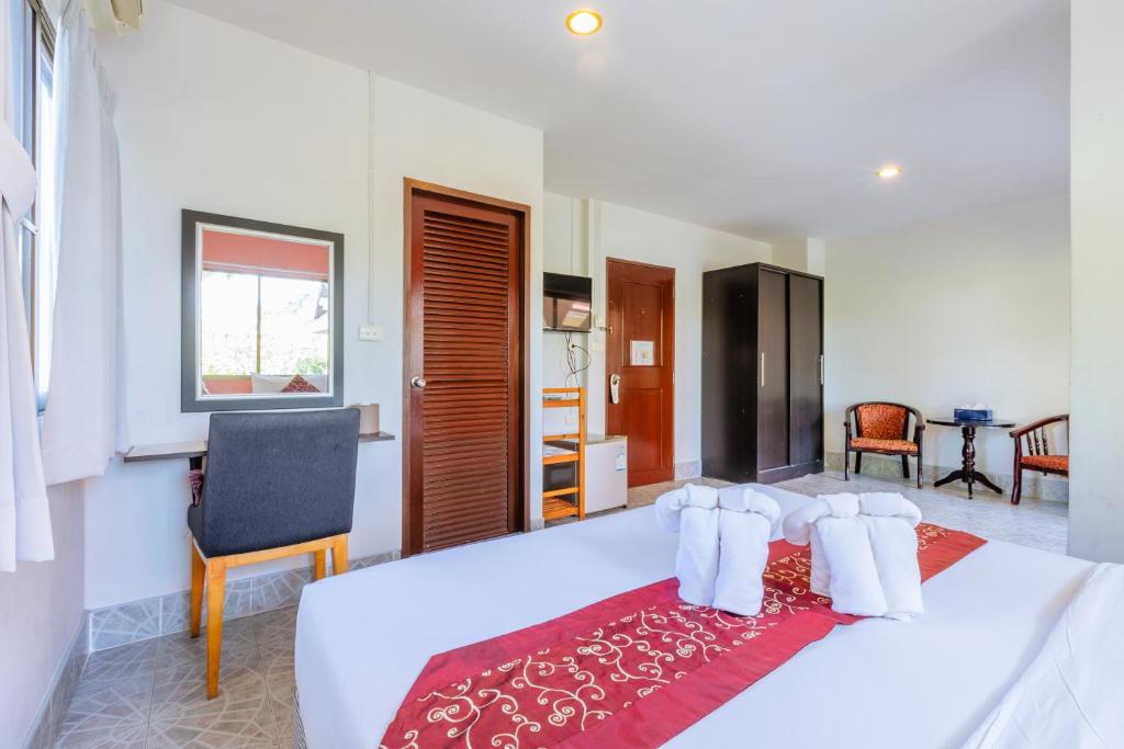 Postel nebo postele na pokoji v ubytování Hua Hin Star Hotel