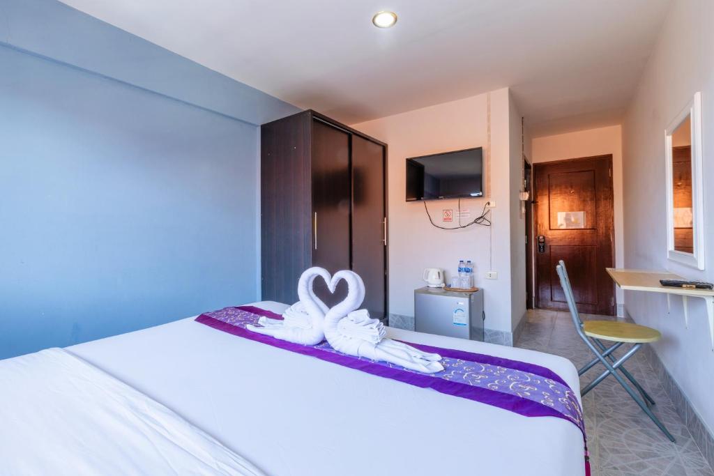 Postel nebo postele na pokoji v ubytování Hua Hin Star Hotel