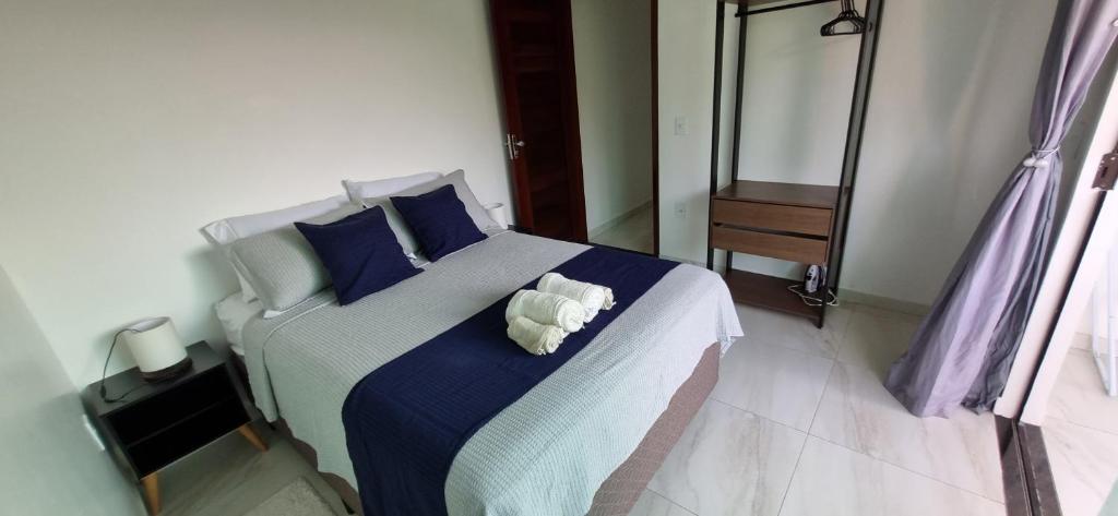 Ένα ή περισσότερα κρεβάτια σε δωμάτιο στο Casa Xodozinho