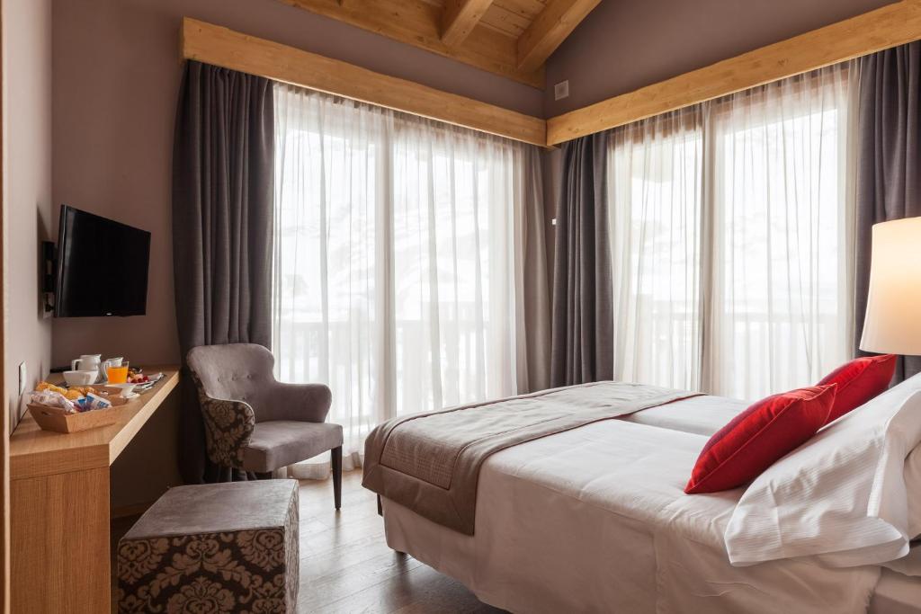 A bed or beds in a room at Excelsior Planet