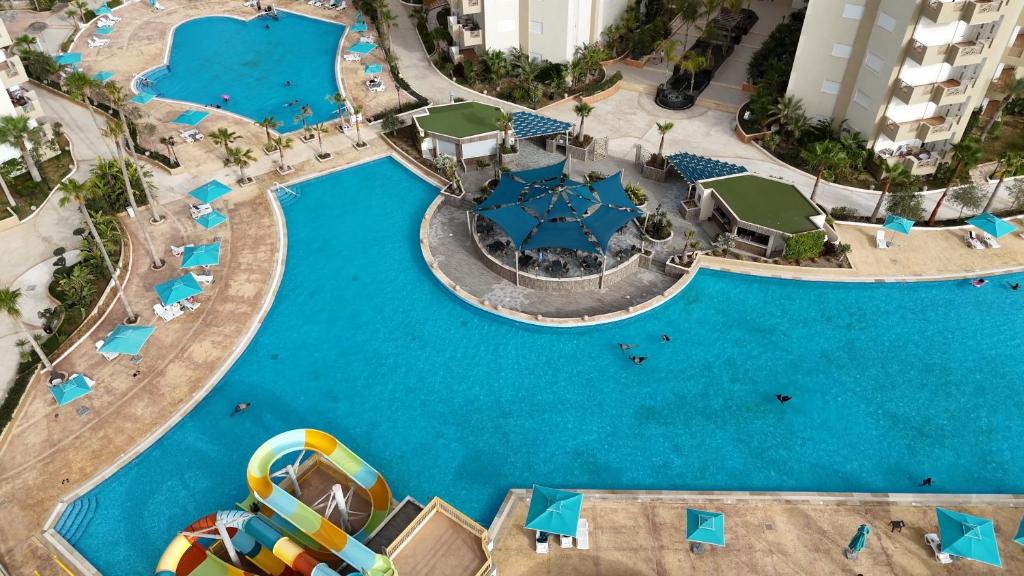an aerial view of the pool at a resort at Palm Lake Resort Folla Monastir in Monastir